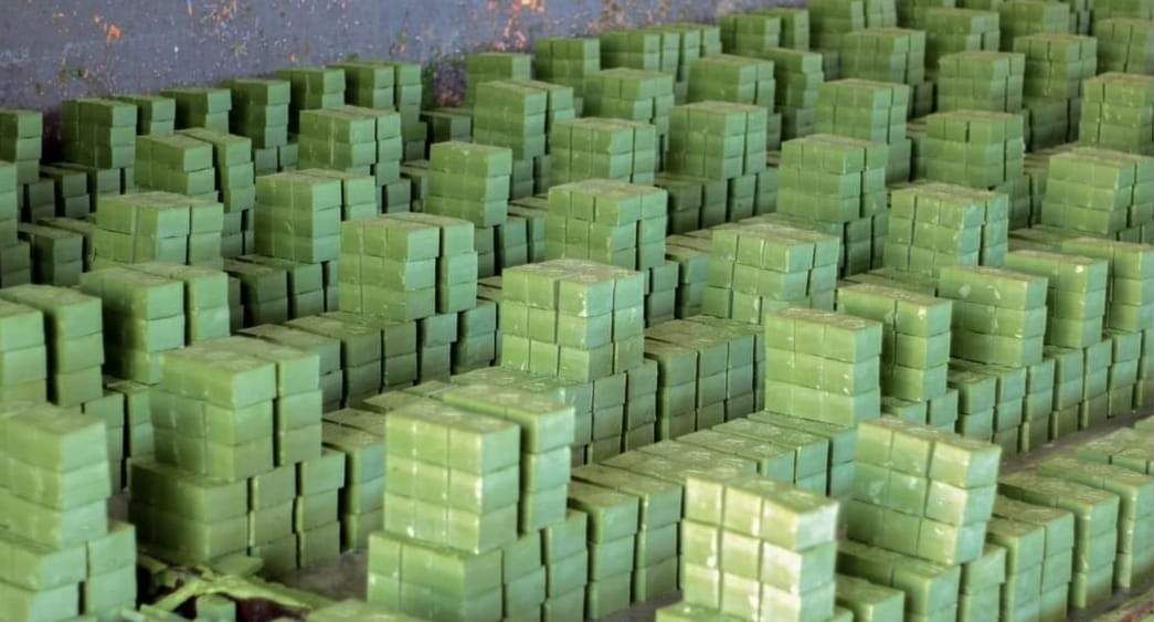 Wide view of the workshop floor covered in arranged soap bars